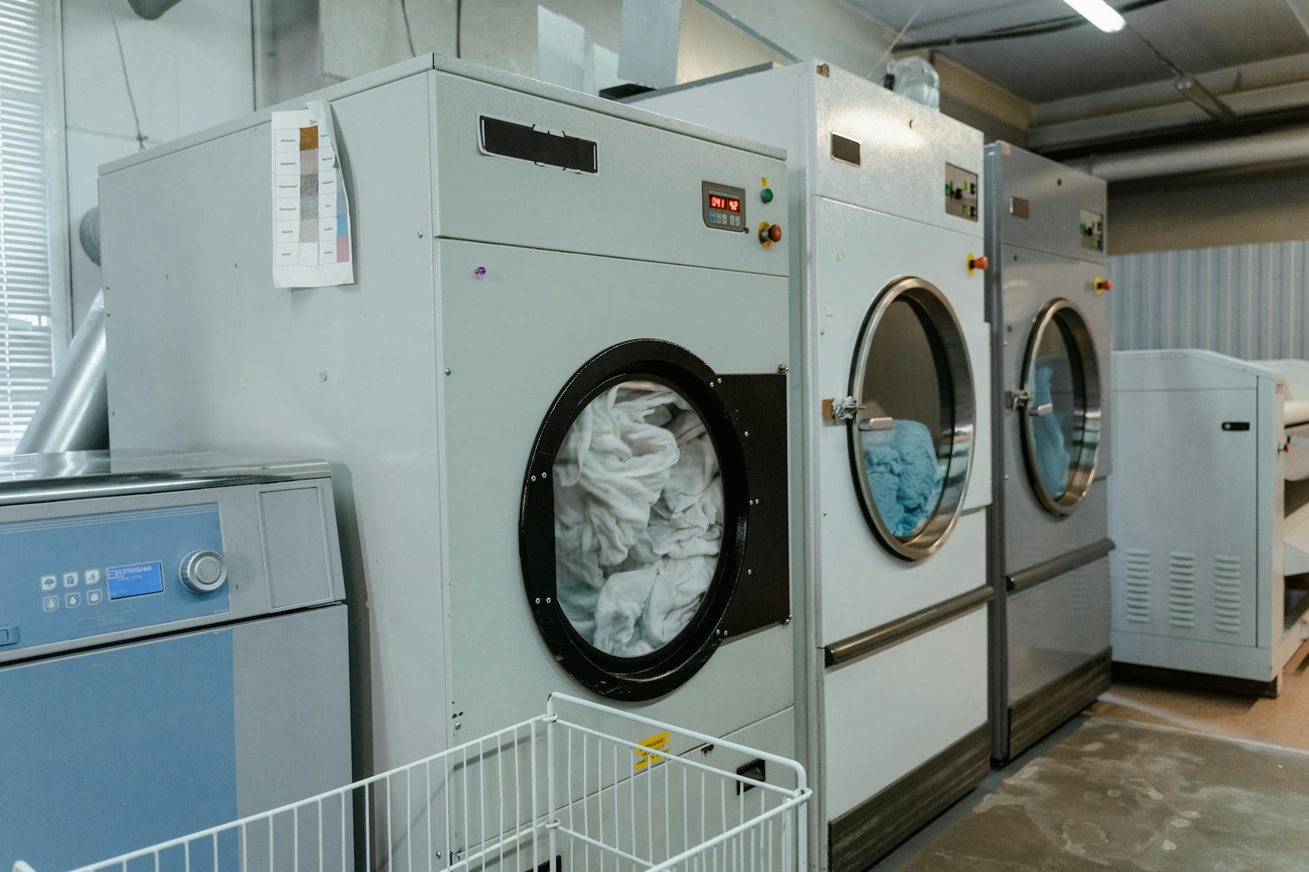 Custom parabet cabinetry installation in apartment laundry nook